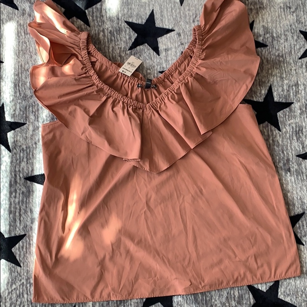Suuuuuuper sexy blouse. The color is champagne.